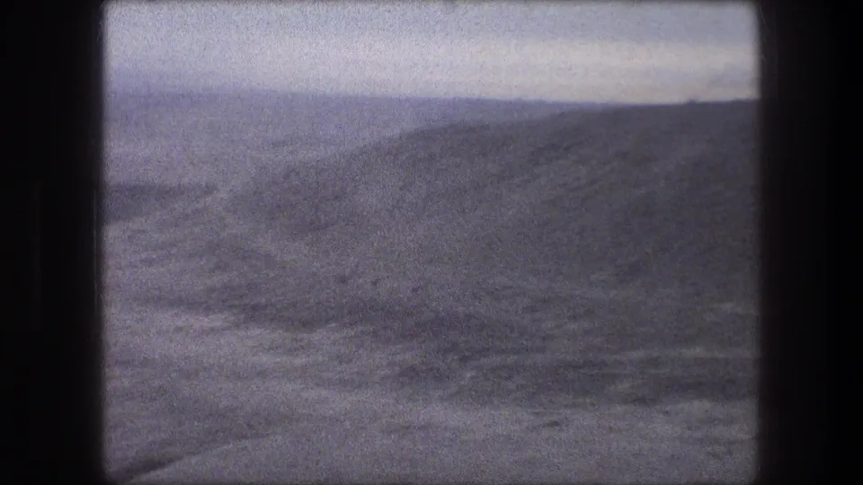 Bethlehem-area 8mm travel footage from 1976, showing arid hills and foreground ground blur.