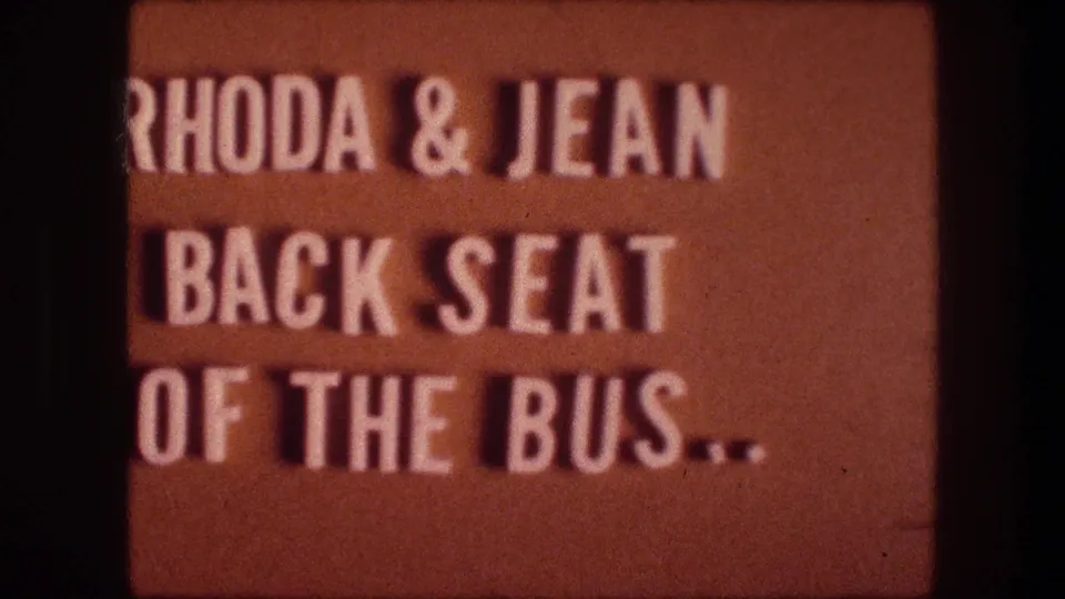 Soft-focused 1976 8mm title card from Bethlehem, Israel, identifying Rhoda and Jean in the back seat of the bus.
