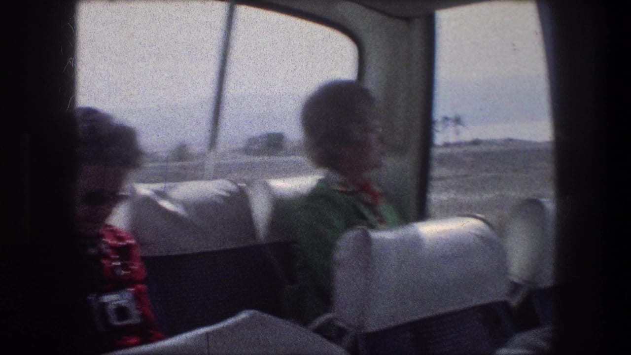 1976 Bethlehem, Israel bus interior with adult women seated near bright windows, including one holding a small camera.