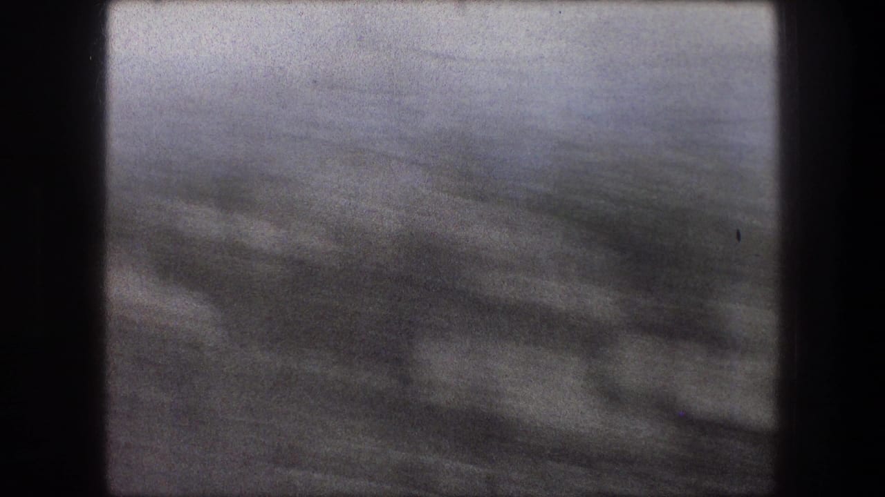 1976 Bethlehem travel footage frame with indistinct vegetation and horizon softened by rapid camera movement.