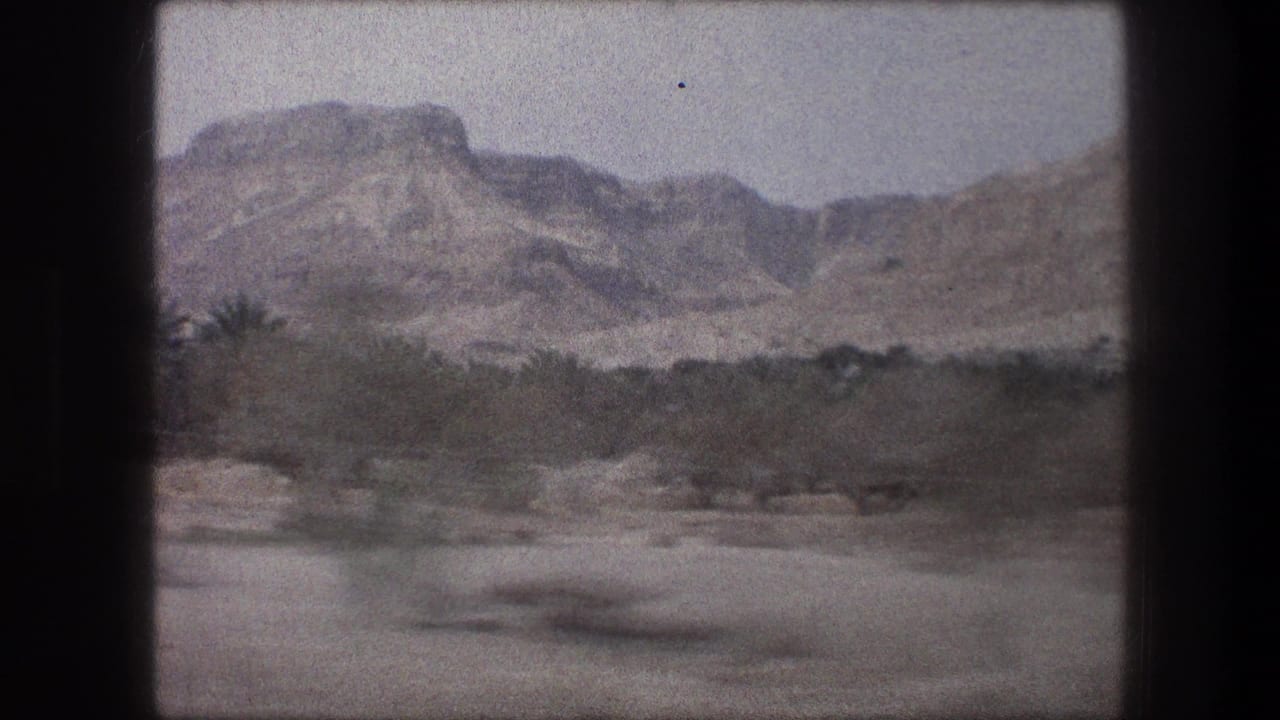 Bethlehem-area travel footage from 1976 shows rocky arid hills and scrub through a moving window view.