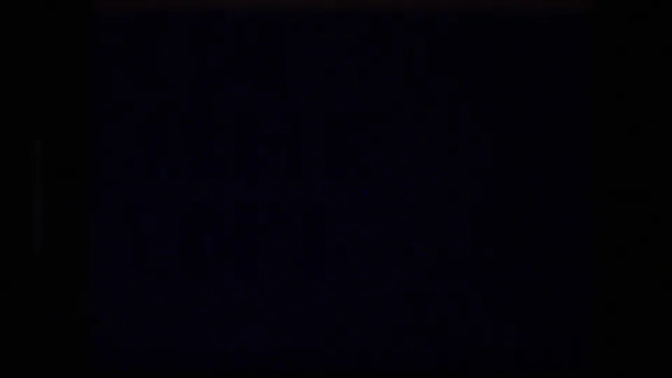 Mostly dark 8mm transitional frame between the title card and the outdoor Garden Tomb view.