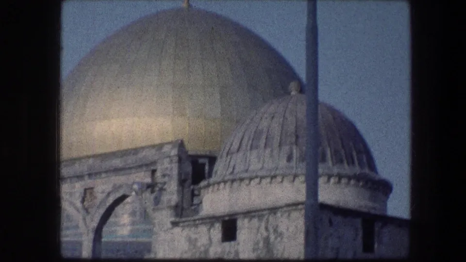 1976 Garden Tomb Jerusalem footage showing a golden dome, smaller domed roof, and stone arch details.