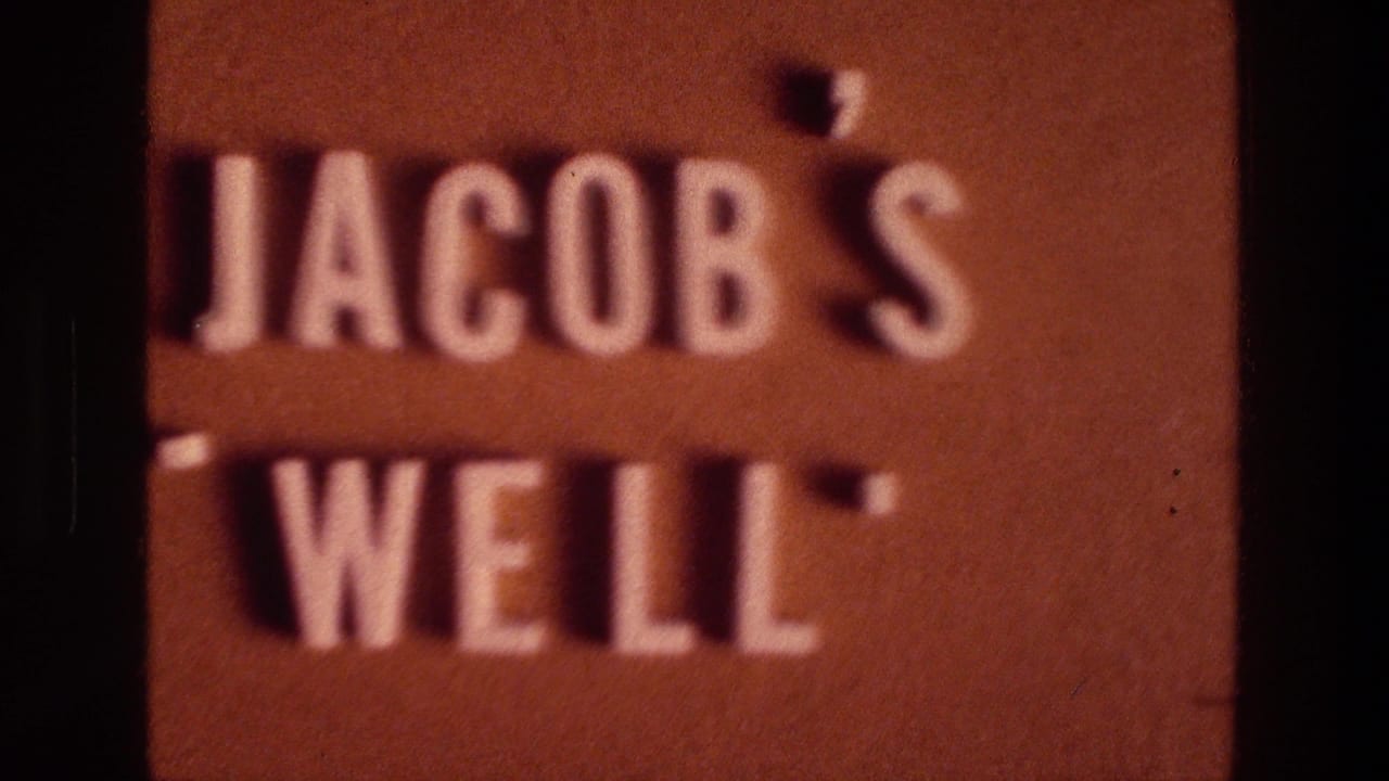 Close-up of the Jacob's Well sign repeated in soft focus.