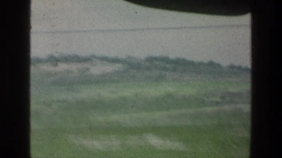 A moving 8mm view near the listed Jerusalem area shows blurred greenery, low hills, and a dark vertical window frame.