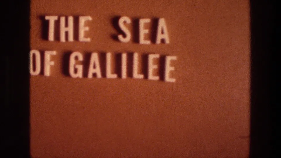 8mm title card from the supplied 1976 Israel reel reads THE SEA OF GALILEE in white block letters on a brown background.