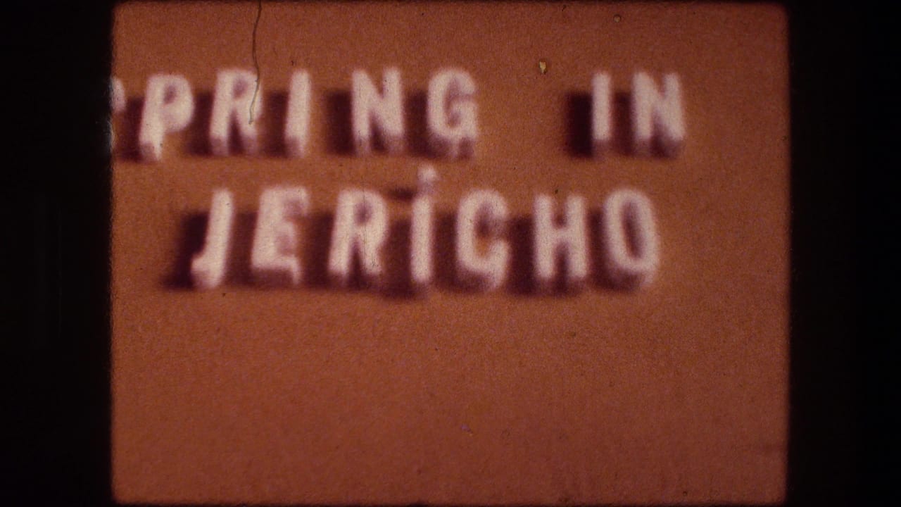 Brown title card with raised white letters reading Spring in Jericho.