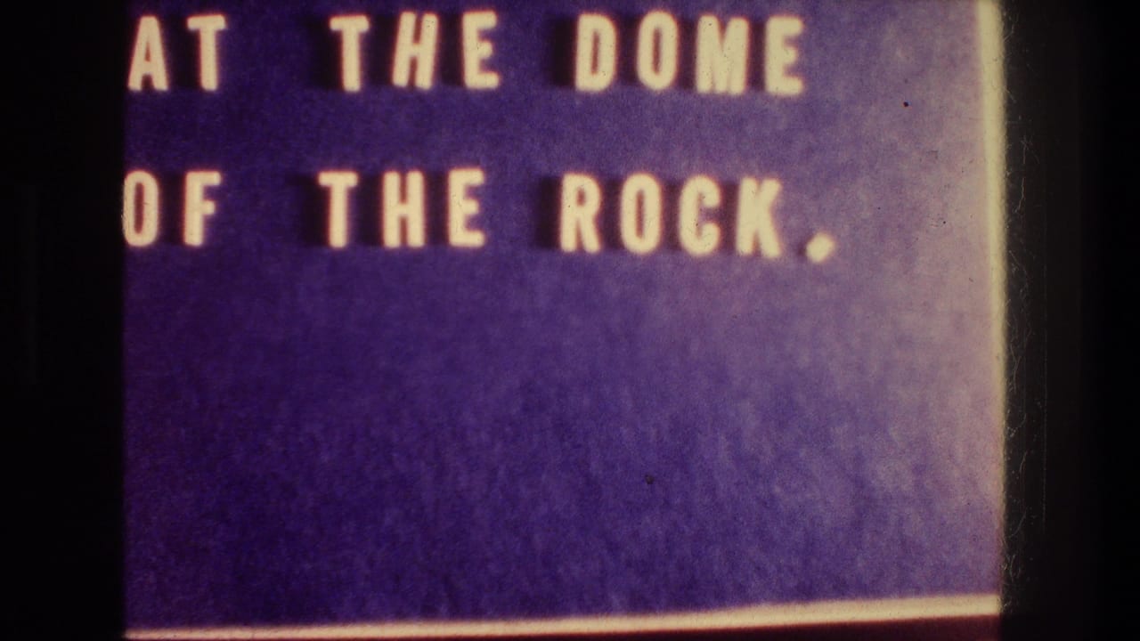 Faded 8mm title card for a 1976 Jerusalem travel scene, reading AT THE DOME OF THE ROCK.