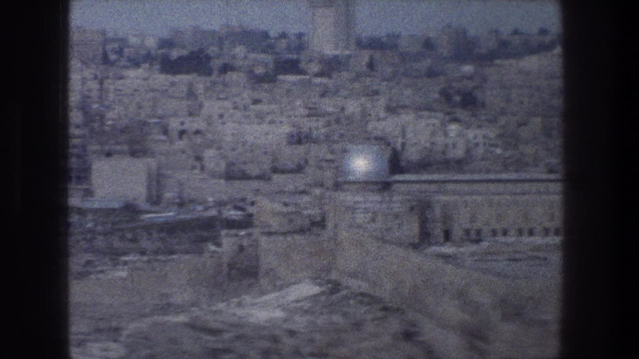 1976 8mm view over Jerusalem’s stone cityscape, with the Dome of the Rock visible in the distance.