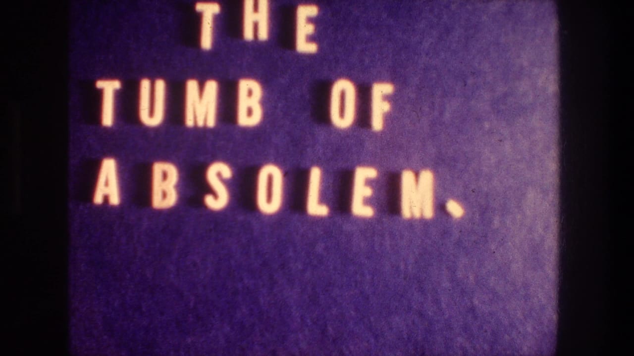 1976 8mm title card with misspelled text for the Tomb of Absalom, shown as warm letters on a purple film background.