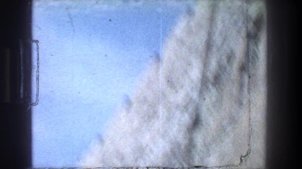 Soft 8mm frame showing a pale wall or stone surface near the labeled Jerusalem site.