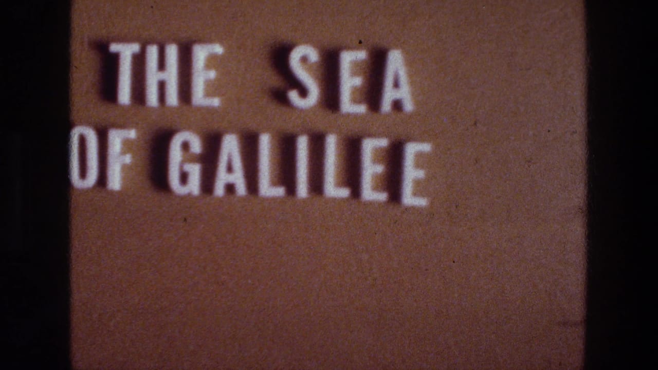 8mm title frame for the Sea of Galilee, with white lettering, warm brown background, grain, and a central dark divider visible.