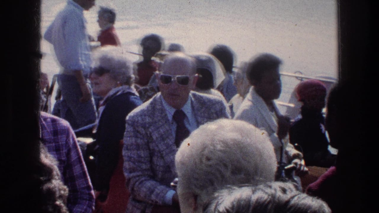 Older passengers in sunglasses sit among a crowded boat group.