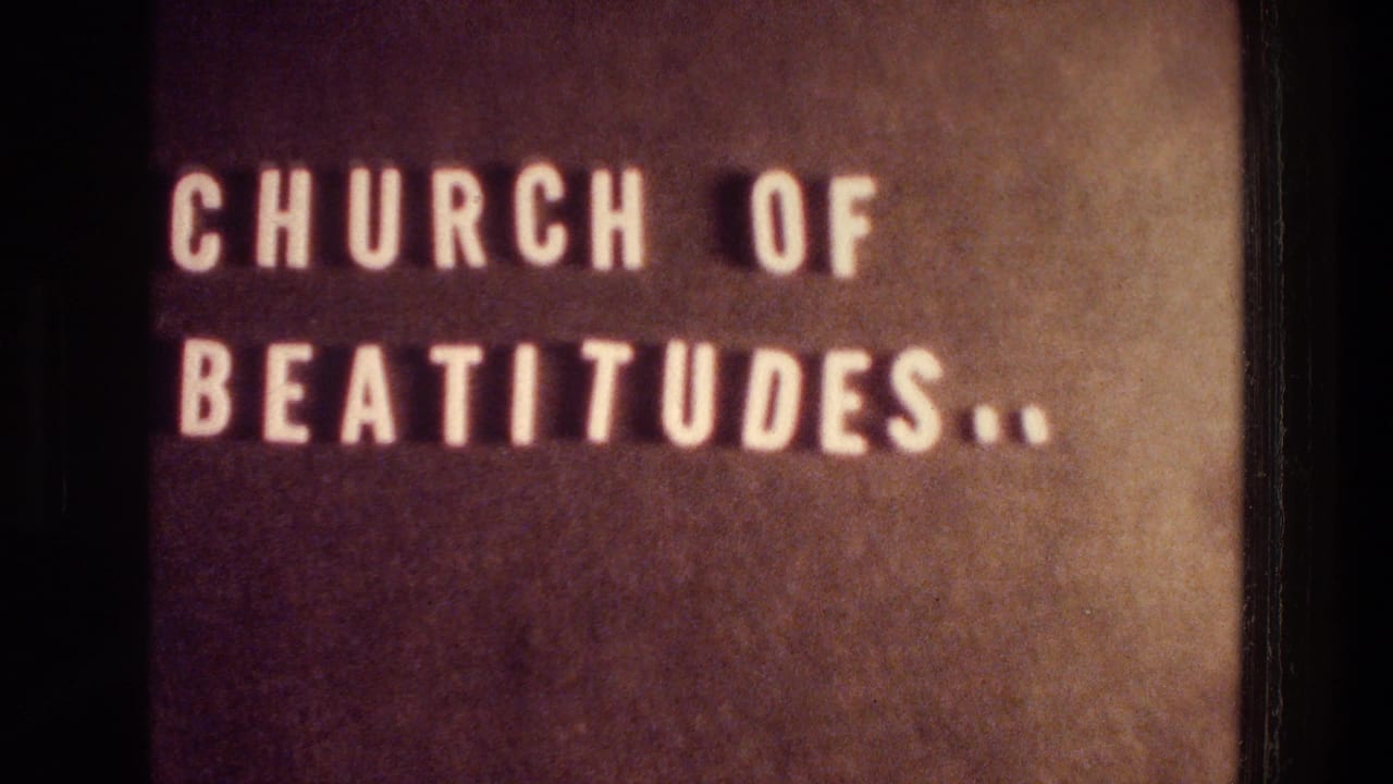 Close-up of a brown sign reading CHURCH OF BEATITUDES in white letters.
