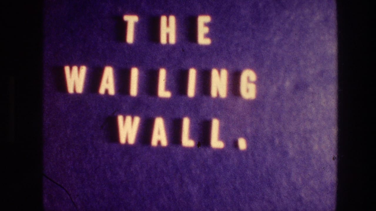 Repeated 1976 8mm title card identifying the Wailing Wall, shown with warm letters and visible film texture.