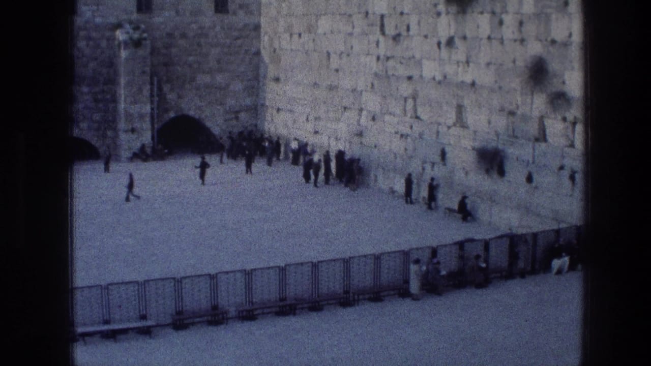 High-angle view of people standing and walking near the Wailing Wall courtyard.
