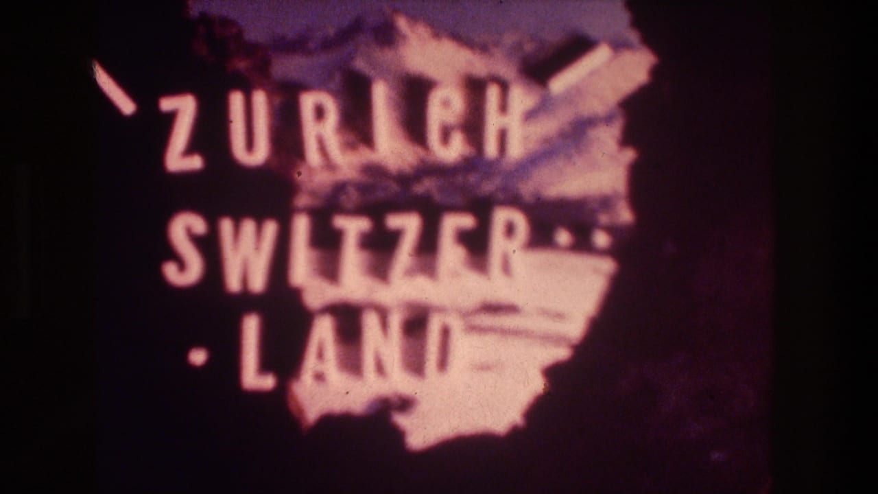 Soft 1976 8mm title card reading Zurich Switzerland over a pink-tinted map silhouette on a dark background.