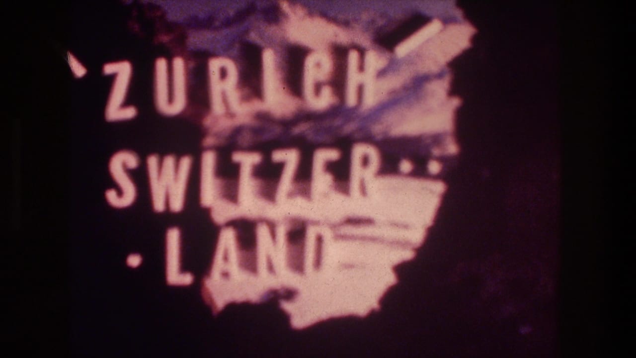 Close 1976 8mm view of the Zurich Switzerland title card, with bold white lettering and a pink map-like graphic.