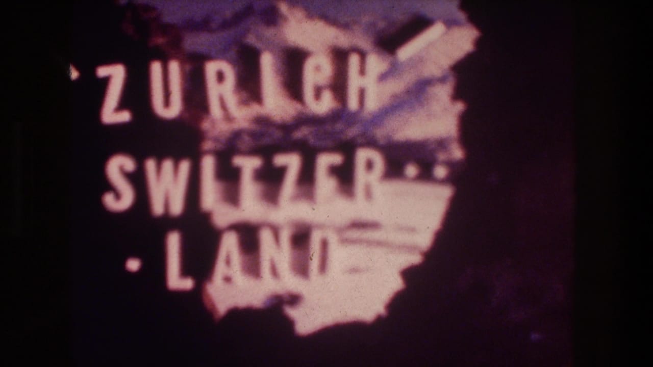 Soft projected title card reading Zurich Switzerland over a purple graphic field.