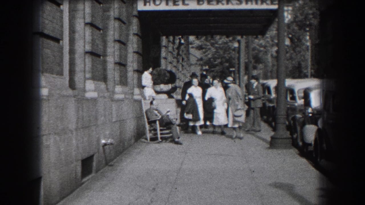 1938 Reading, Pennsylvania home-movie frame showing women leaving the Hotel Berkshire entrance with parked cars along the curb.