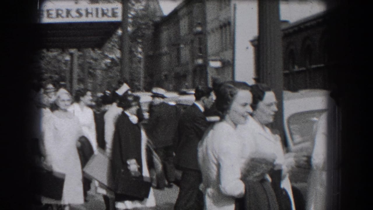 1938 Reading, Pennsylvania street scene with people gathered near the Hotel Berkshire sign and parked cars.