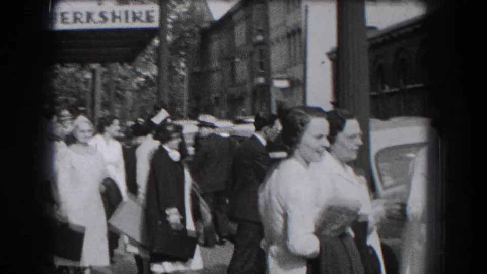 1938 Reading, Pennsylvania street scene with people gathered near the Hotel Berkshire sign and parked cars.