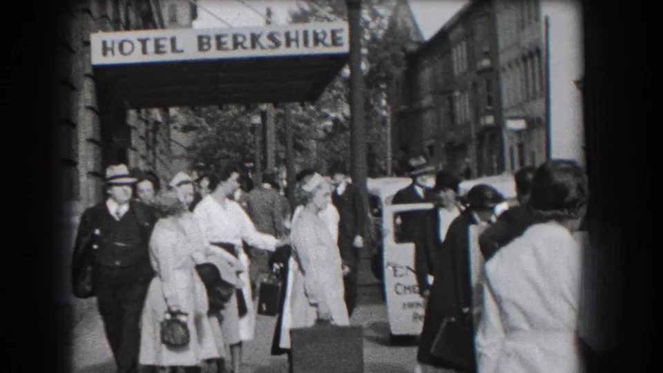 1938 Reading, Pennsylvania street scene with pedestrians in period dress beneath the Hotel Berkshire canopy.