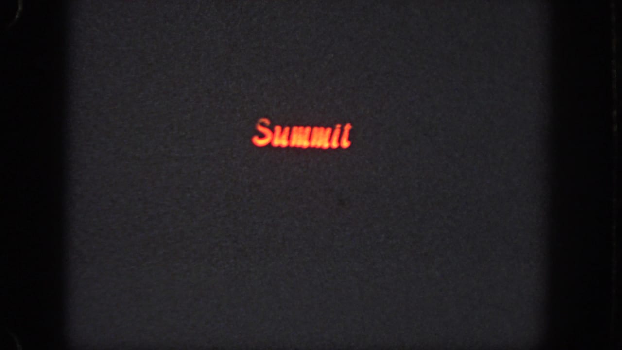 Red Summit logo on a dark background with visible film grain.