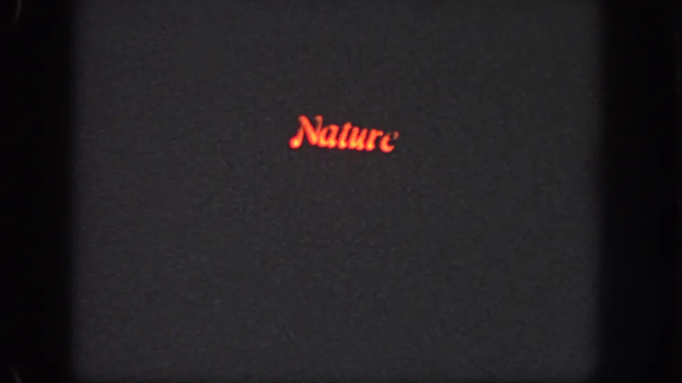 1951 Georgia 8mm frame with a dark background and a red title-like word reading Nature near the lower right.