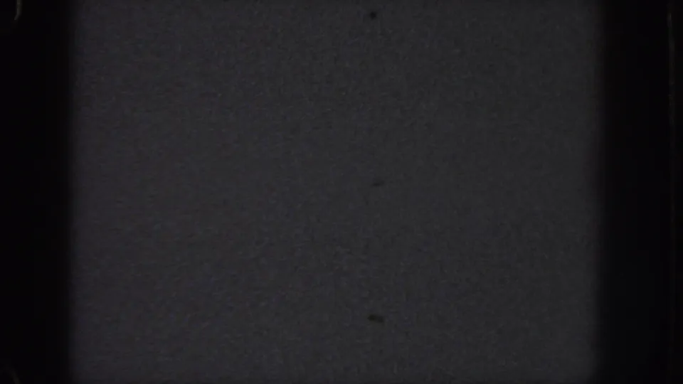 Dark 1951 Georgia 8mm home-movie frame showing grain, edge falloff, and no discernible subject.