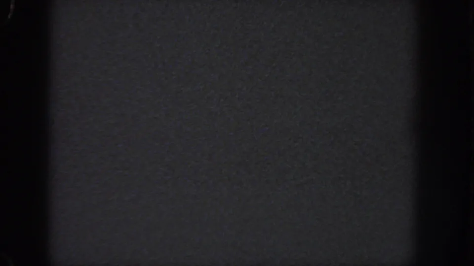 Dark 1951 Georgia 8mm home-movie frame with grain, vignetting, and no discernible people, objects, or location detail.