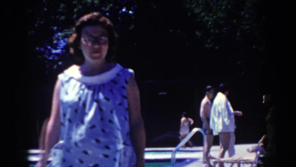 The final frame brings the woman close to the camera on the 1958 pool deck, with background swimmers, metal rails, and shaded trees still visible.