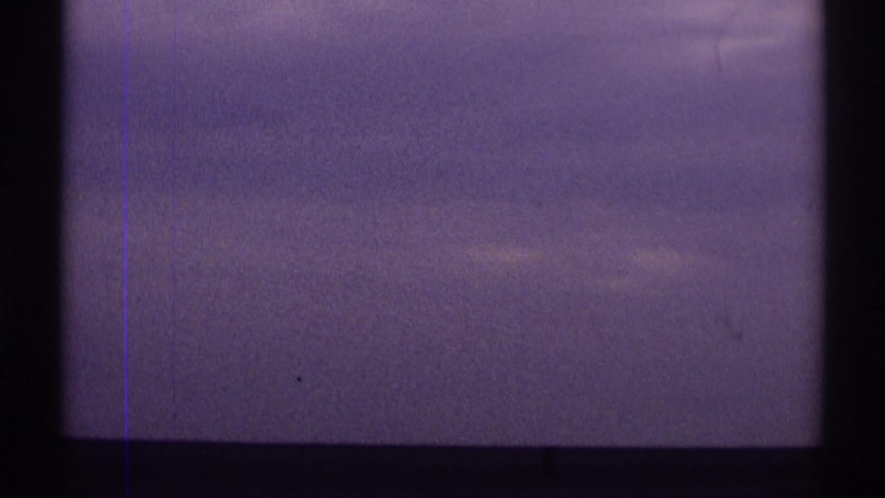 Clouds and purple color shift appear behind dark interior or frame divisions in the road-trip clip.