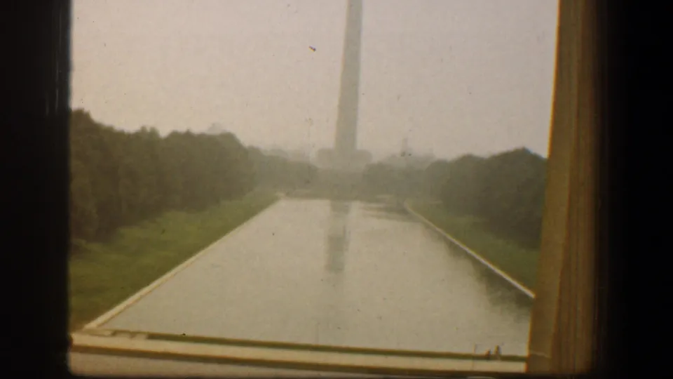 1961 Washington, DC 8mm frame showing the Reflecting Pool and distant Washington Monument from a visitor viewpoint.