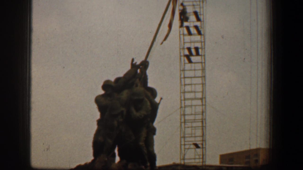 Iwo Jima Memorial sculpture silhouetted with a construction crane behind it.