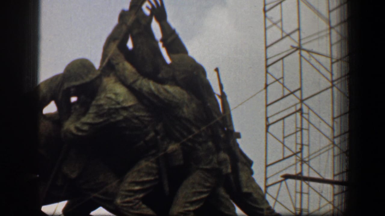 Close view of the Marine Corps War Memorial sculpture with scaffolding behind it.