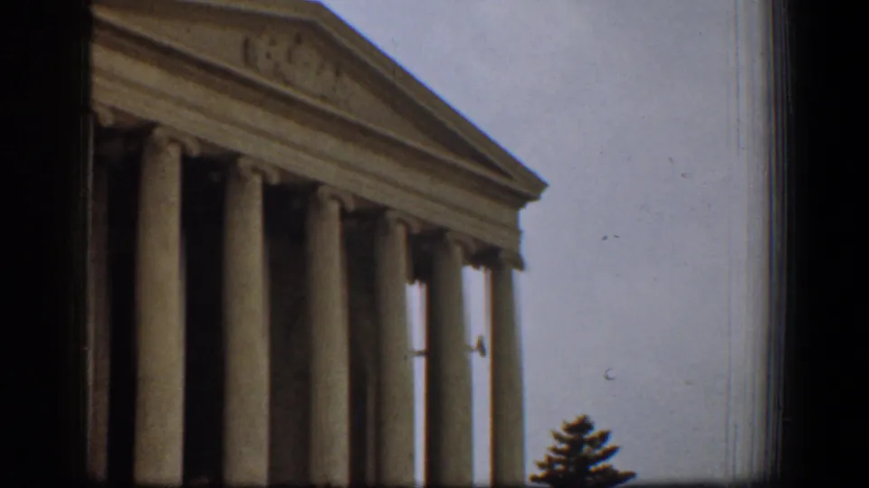 1961 Washington, DC view of the Supreme Court facade, framed tightly on its neoclassical columns and pediment.