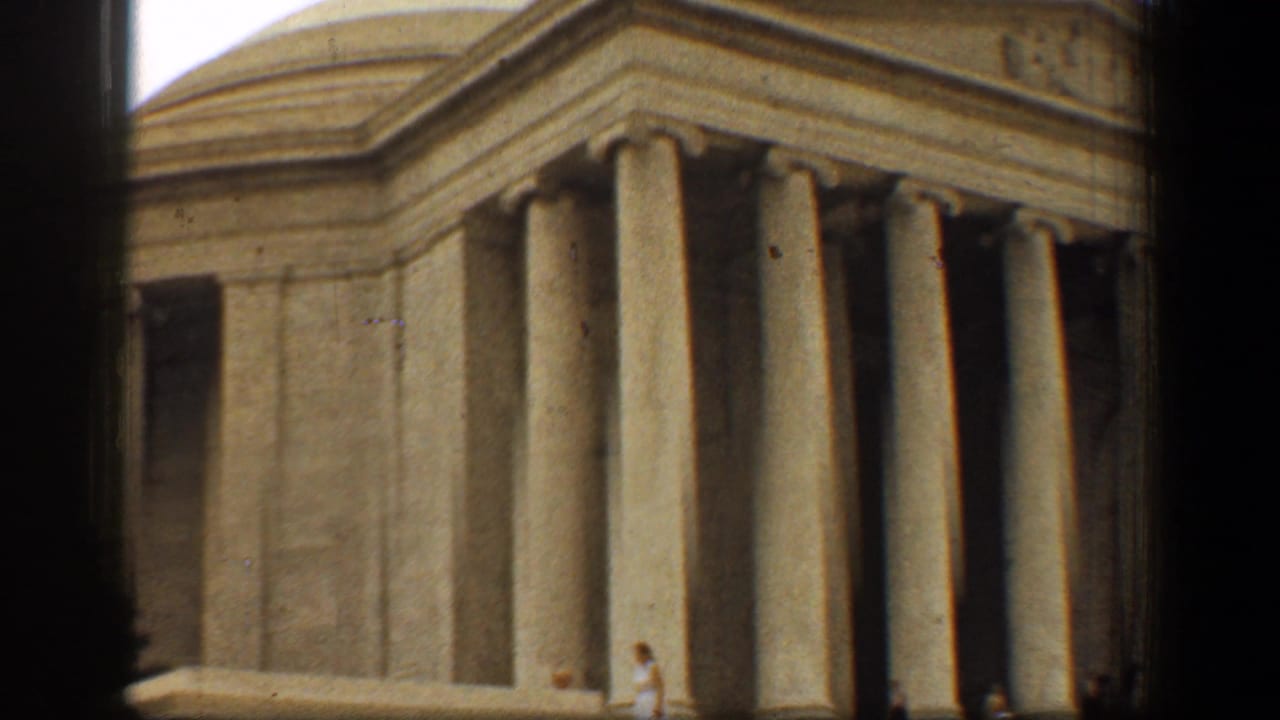 Low-angle view of the Lincoln Memorial columns with dark 8mm frame edges.