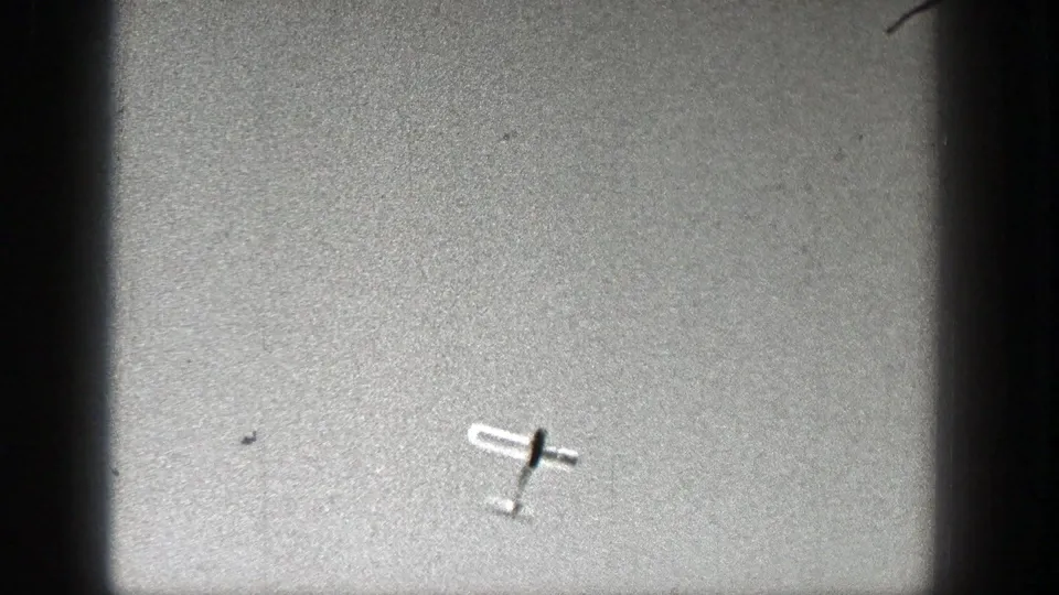 A light aircraft appears at an angle against the sky in the Washington 1938 aviation clip.