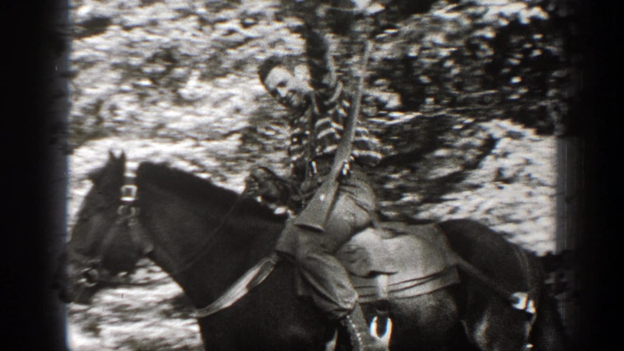 1938 California 8mm frame showing a cowboy-dressed rider on horseback in a wooded outdoor setting.