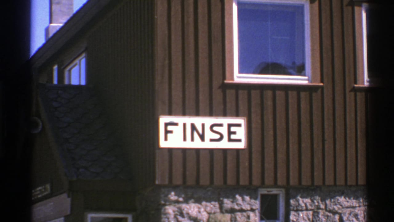 FINSE sign centered on a timber facade with window reflections above.
