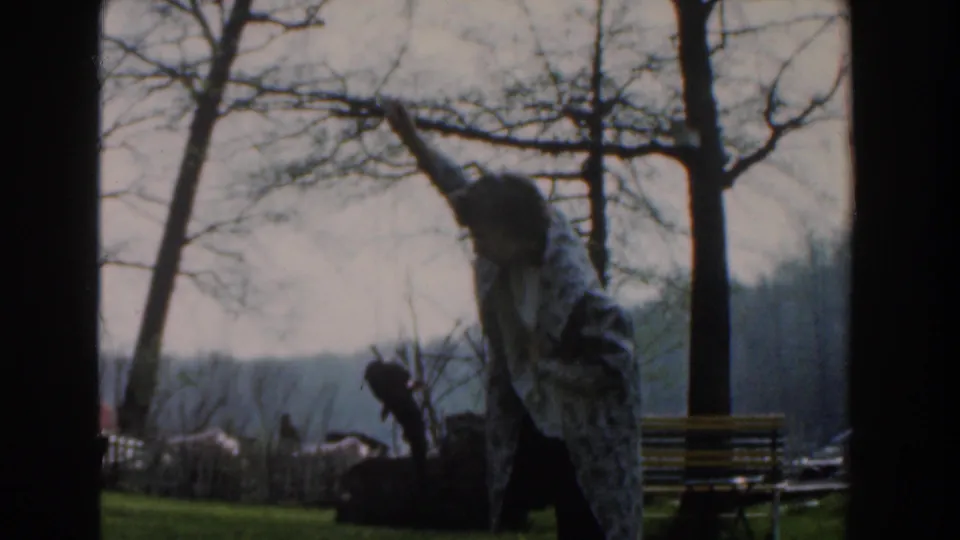 The final frame shows the person still displaying the fish in the outdoor Novi, Michigan setting.