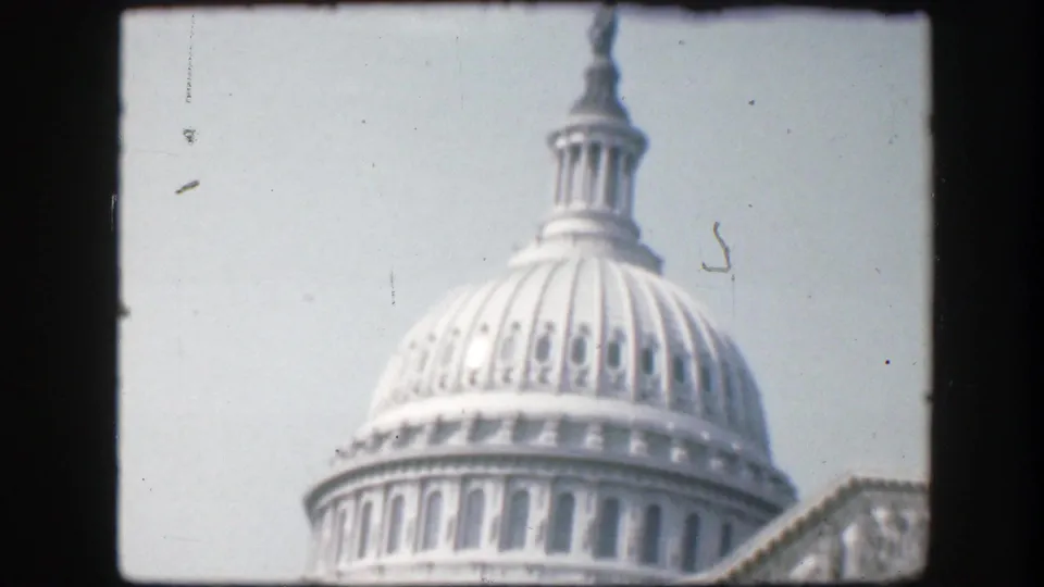 1945 Washington D.C. frame of the Capitol dome, cupola, and adjacent roofline from a visitor viewpoint.