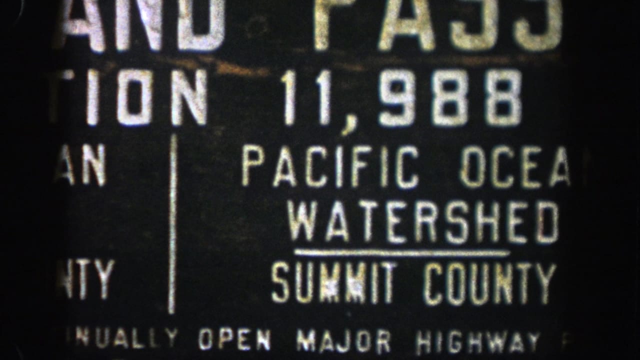 Close view of a Pacific Ocean Watershed sign with Summit County text.