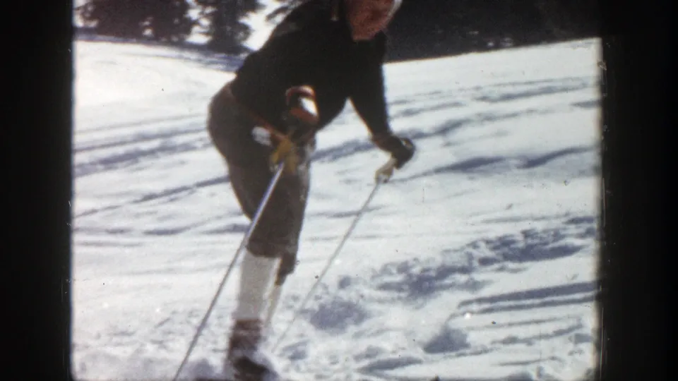 The final frame shows the skier bent forward on the snowy Aspen slope, with poles planted near visible ski tracks.