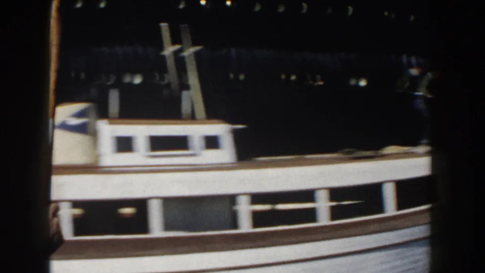 The final frame shows a small vessel close to the camera with the ocean liner's hull and deck structures behind it.