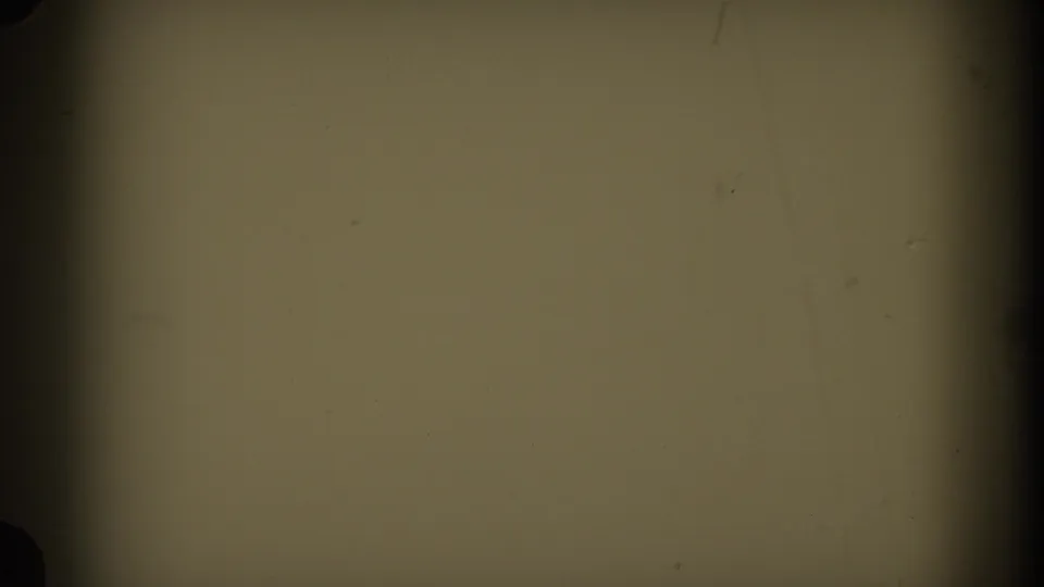 Faded 8mm frame from the 1960 Italy reel, mostly blank with dark edge shadows, muted yellow-green tone, grain, and dust.