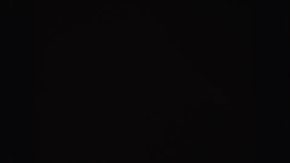 Underexposed final frame from the 1962 California pool clip, with the right side largely dark and minimal visible water detail.