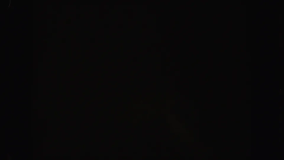 Underexposed 1962 California 8mm frame showing faint film grain, a vertical frame division, and no identifiable subject.