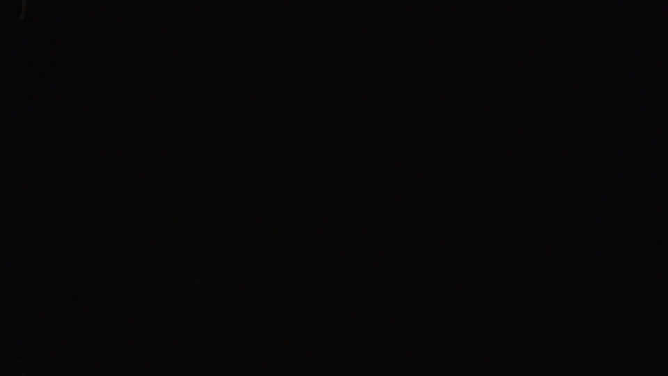 1962 California 8mm frame with almost no visible subject, showing black exposure, minor speckles, and subtle physical-film marks.
